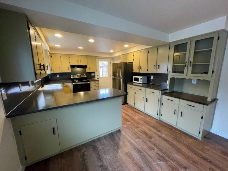 Improvements: cabinet removal, sheetrock repair, cabinet paint and hardware, flooring, trim